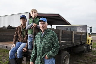 Multi-generation family working on the farm farming without the bank