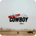 The Wealthy Cowboy Show logo over desert landscape with cows grazing, highlighting rural wealth themes.